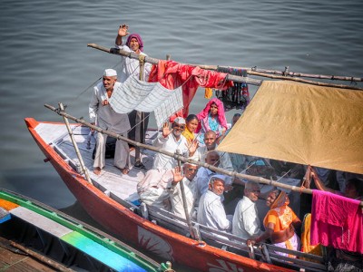 We enjoyed a walk along the ghats in Varanasi from the Assi to Dashashwamedh (main) ghat. Ghats are the steps that lead down to the Ganges River. I didn't intend to take this photo as I was aiming my camera at the boats nearby, but the people started to wave and I couldn't resist those smiles. 