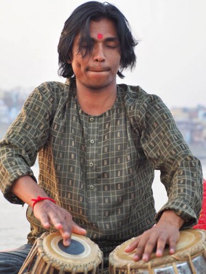 A musician gets lost in the rhythm of the tabla drum and accompanying sitar. This wonderful performance was a part of our afternoon boat ride on the Ganges River in Varanasi, India. 
